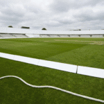 Blank advertising hoardings around a cricket stadium boundary