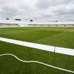 Blank advertising hoardings around a cricket stadium boundary